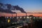 Industrial cityscape with smoke of chimneys