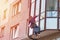 Industrial climber cleaning window on building in the city