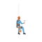 Industrial climber hanging on ropes, man in helmet holding paint roller