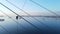 An industrial climber hangs on the icy edges of the Russian Bridge