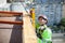 Industrial climber measuring with level tube during construction works