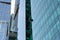 Industrial climber washes glass on the facade of a skyscraper