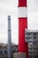 industrial climbers carry out routine repairs. white smoke on a gray sky background