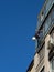 Industrial climbing. Climber wash windows in a high-rise building. Cleaning of windows glass elements.