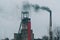 Industrial coal mine billowing black smoke into skies. Stop pollution. Industrial chimney