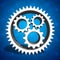 Industrial cogs gears on blue background