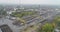 Industrial complex aerial view. Gantry cranes and trucks near a large warehouse. Large industrial area top view.
