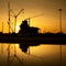 Industrial construction cranes and building silhouettes