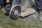 Industrial construction worker using a professional angle grinder