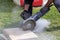 Industrial construction worker using a professional angle grinder