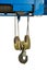 Industrial crane hook hanging with sling in factory isolated on