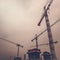 Industrial Cranes on Construction Site, Retro Toned