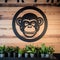 Industrial Design Monkey Logo On Wall With Potted Plants