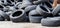 Industrial dump for the processing of used tires and rubber tires. Pile of old tires and wheels for rubber recycling