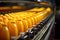 Industrial efficiency: machinery on a conveyor, producing and packaging sweet orange drinks