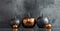 Industrial Elegance Hallowen decor. A striking image of a sleek and modern pumpkin arrangement set against an industrial backdrop