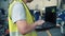 Industrial engineer with hard hat working with laptop at factory