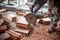 Industrial engineer working on cutting bricks at construction site, using a grinder, electrical mitre saw with sharp blade