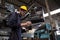 Industrial Engineers wearing yellow hard hats working at the heavy industry .