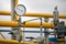 Industrial equipment pipes, manometer/pressure gauge, levers, faucets, indicators in a natural gas compressor station