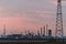 Industrial factory on sky sunset background, Petrochemical plant with sky evening background. Northern Italy work in a modern