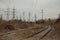 Industrial foggy landscape - old abandoned industrial zone in autumn forest