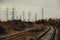 Industrial foggy landscape - old abandoned industrial zone in autumn forest