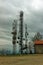 Industrial high power telecommunication tower on mountain, gloomy overcast