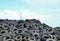 Industrial landfill for the processing of waste tires and rubber tyres. Pile of old tires and wheels for rubber recycling