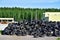 Industrial landfill for the processing of waste tires and rubber tyres. Pile of old tires and wheels for rubber recycling. Tyre