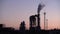 Industrial landscape, the pipes of the thermal power plant at sunset.