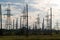 Industrial landscape with power lines in the background pipes refinery