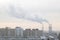 Industrial landscape smoke from the chimney of a large plant in winter