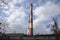 Industrial landscape with two red and white industrial chimneys. Coal mine in Katowice, Poland.