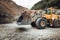 Industrial machinery working with rock breaker and crusher, dumper trucks
