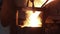 Industrial molten steel pour from furnace with intense heat, sparks in metalwork foundry, metallurgy process. Workers