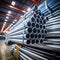 Industrial Pipeline Awaits: Stack of Galvanized Steel, Aluminum, and Chrome Stainless Pipes in Warehouse for Shipment