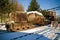 Industrial plant torpedo car train rail in winter snow ice steel