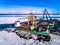 Industrial port with containers, vessel loading in port of Finland