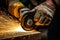 Industrial precision, Close-up of worker using angle grinder to cut steel