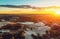 Industrial quarry, hills of white chalk and industrial digging machinery at sunset, aerial view with copy space