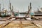 An industrial rail boat ramp or boat deployer on platform in a fishermen village is rusty and seems misused and abandoned. Dragor