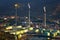 Industrial refinery and storage tanks with smokestack