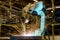 Industrial robots are welding assembly automotive part in car factory