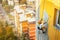 Industrial rope access worker hanging from the building while painting the exterior facade wall. Industrial alpinism concept image