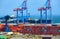 Industrial seaport infrastructure, sea, container ship and cranes, commercial dock with container warehouse, maritime cargo