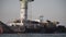 Industrial ship crane lifts old sunken tanker Delfi from Black Sea in Odessa, Ukraine 26 August 2020. Ship crashed near