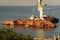 Industrial ship crane lifts old sunken tanker Delfi from Black Sea in Odessa, Ukraine 26 August 2020. Ship crashed near shore sea