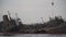 Industrial ship crane lifts old sunken tanker Delfi from Black Sea in Odessa, Ukraine. Ship crashed near shore sea