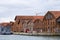 Industrial shipyards Arsenale di Venezia in Italy, Venice. Loading cranes and docks. Cloudy, summer